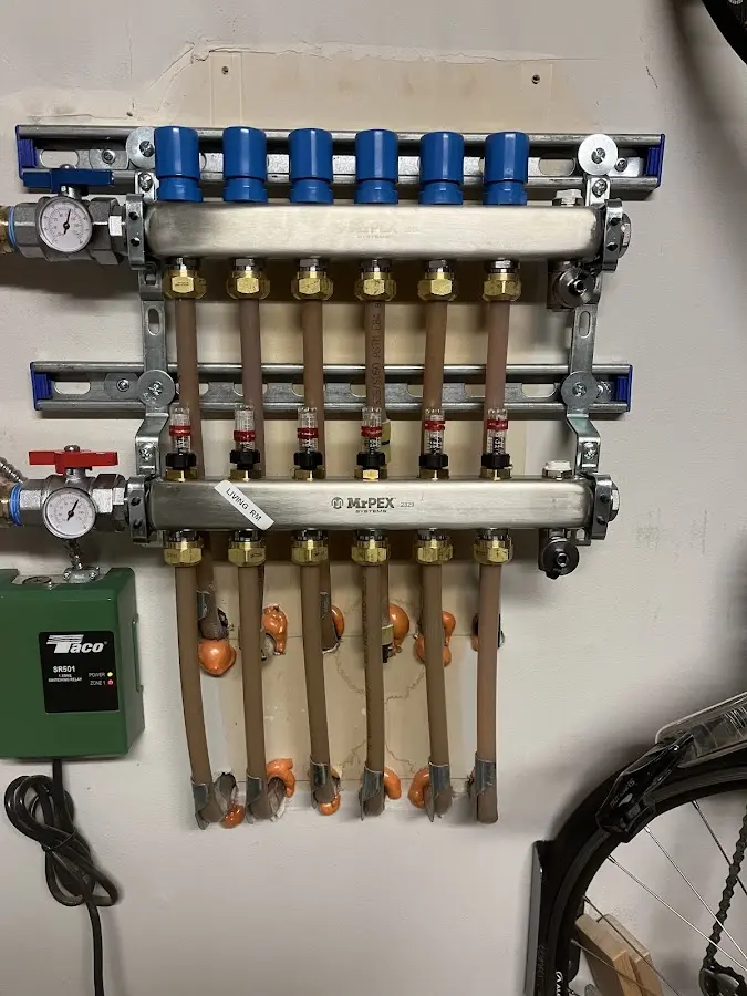 Plumber performing Gas Leak Detection at a residential property in Essexville